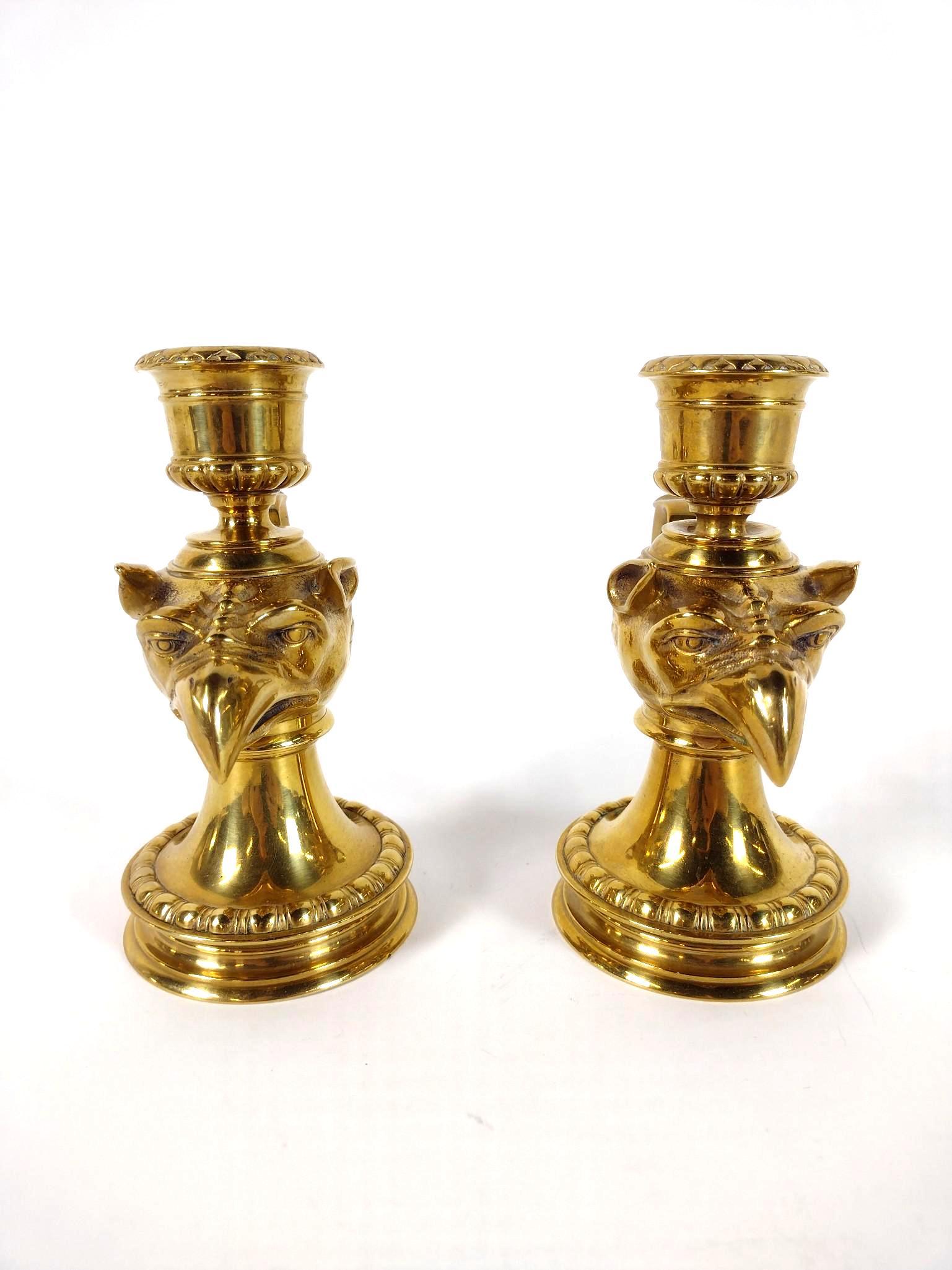 Pr Brass Griffin Candle Holders: Unmarked. Each 4-1/2" wide X 3" diameter X 6" high EL From the estate of Robert Harman. IMPORTANT: Before bidding, please read the terms and conditions. When you registered for the auction you agreed 
