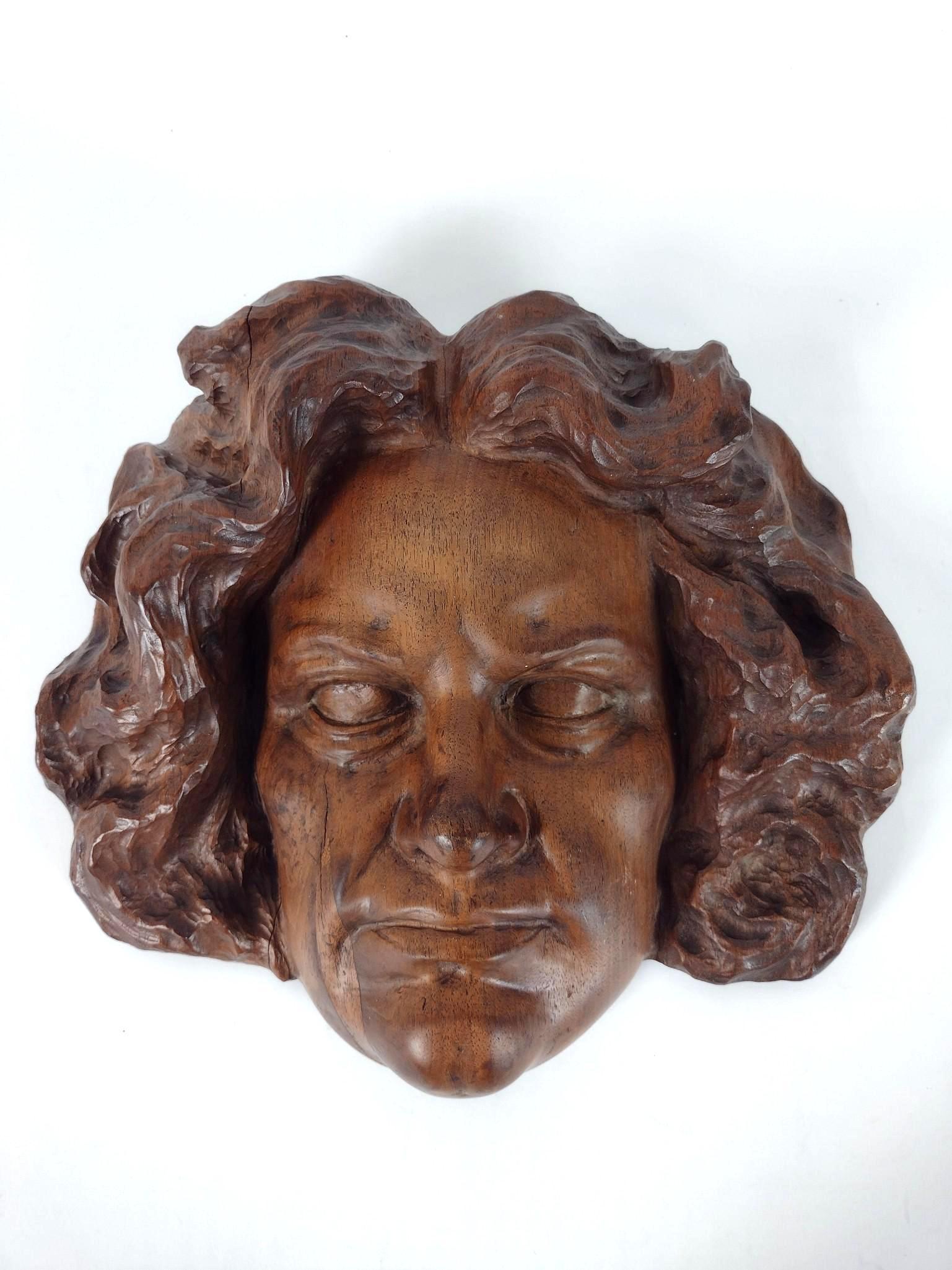 Wood Carved Sculpture of Beethoven: Unsigned. 12" wide X 3-3/4" deep X 11-1/4" high. EL From the estate of Robert Harman. IMPORTANT: Before bidding, please read the terms and conditions. When you registered for the auction you agreed to