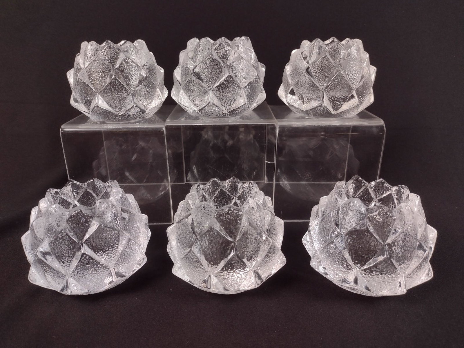 6 Orrefers Votive Candle Holders: Each 4" diameter X 2-3/4" high. EL From the estate of Robert Harman. IMPORTANT: Before bidding, please read the terms and conditions. When you registered for the auction you agreed to these terms and 