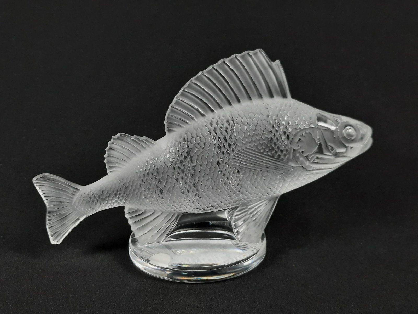 Lalique Fish Figurine: 6-1/4" wide x 2-1/2" deep x 3-3/4" high. LR From the estate of Robert Harman. IMPORTANT: Before bidding, please read the terms and conditions. When you registered for the auction you agreed to these t