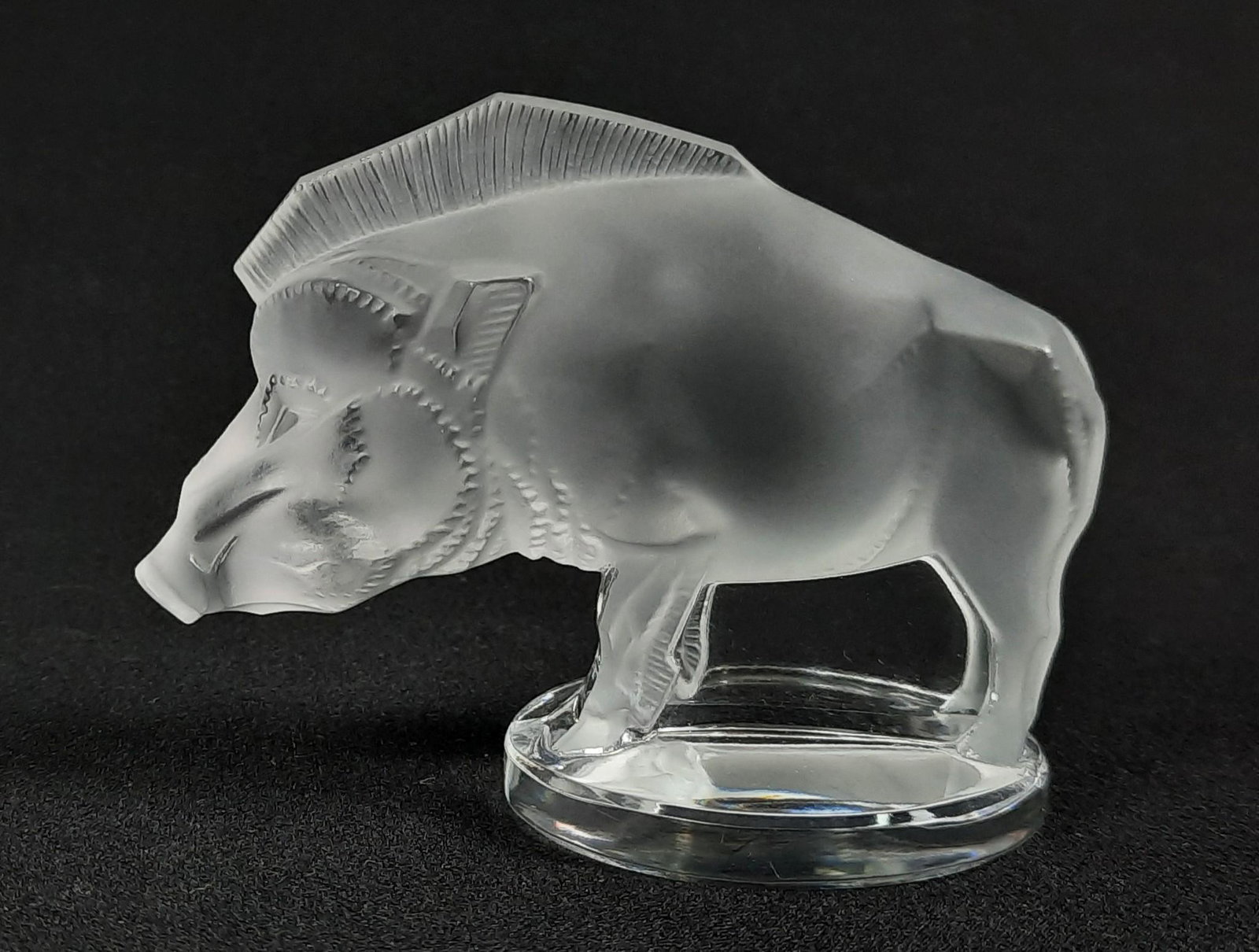 Lalique Boar Figurine: 3-1/2" wide x 2" deep x 2-3/4" high. LR From the estate of Robert Harman. IMPORTANT: Before bidding, please read the terms and conditions. When you registered for the auction you agreed to these terms