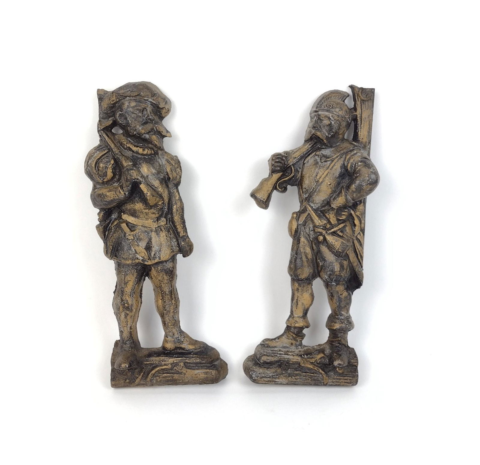 2 Cast Iron Conquistadors: Both 4" wide X 11" high. MEG IMPORTANT: Before bidding, please read the terms and conditions. When you registered for the auction you agreed to these terms and will be required to comply with them.