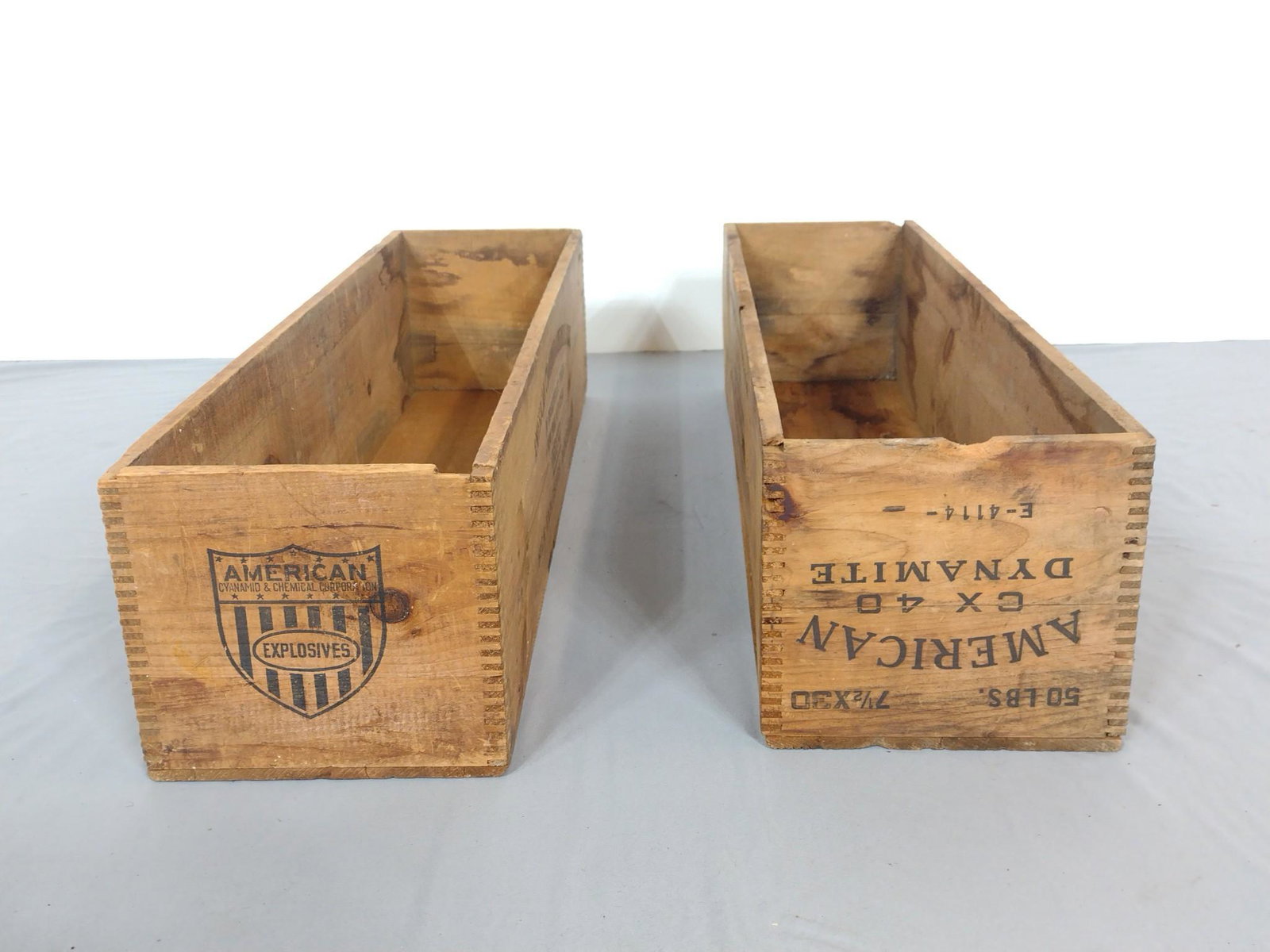 Two American Dynamite Wood Crates: Each 9" wide X 33" deep X 8" high. MG. IMPORTANT: Before bidding, please read the terms and conditions. When you registered for the auction you agreed to these terms and will be required to comply wit