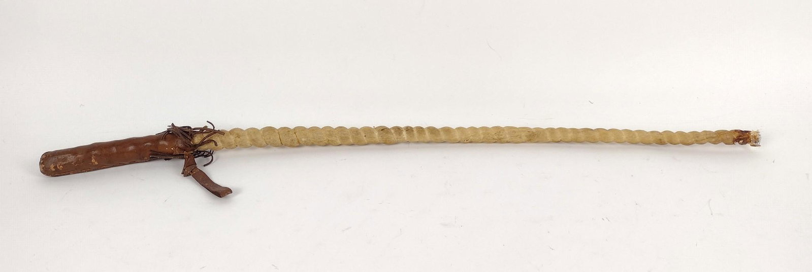 Rawhide and Leather Quirt: 30-1/4" long. Some losses to the handle. MEG IMPORTANT: Before bidding, please read the terms and conditions. When you registered for the auction you agreed to these terms and will be required to comp