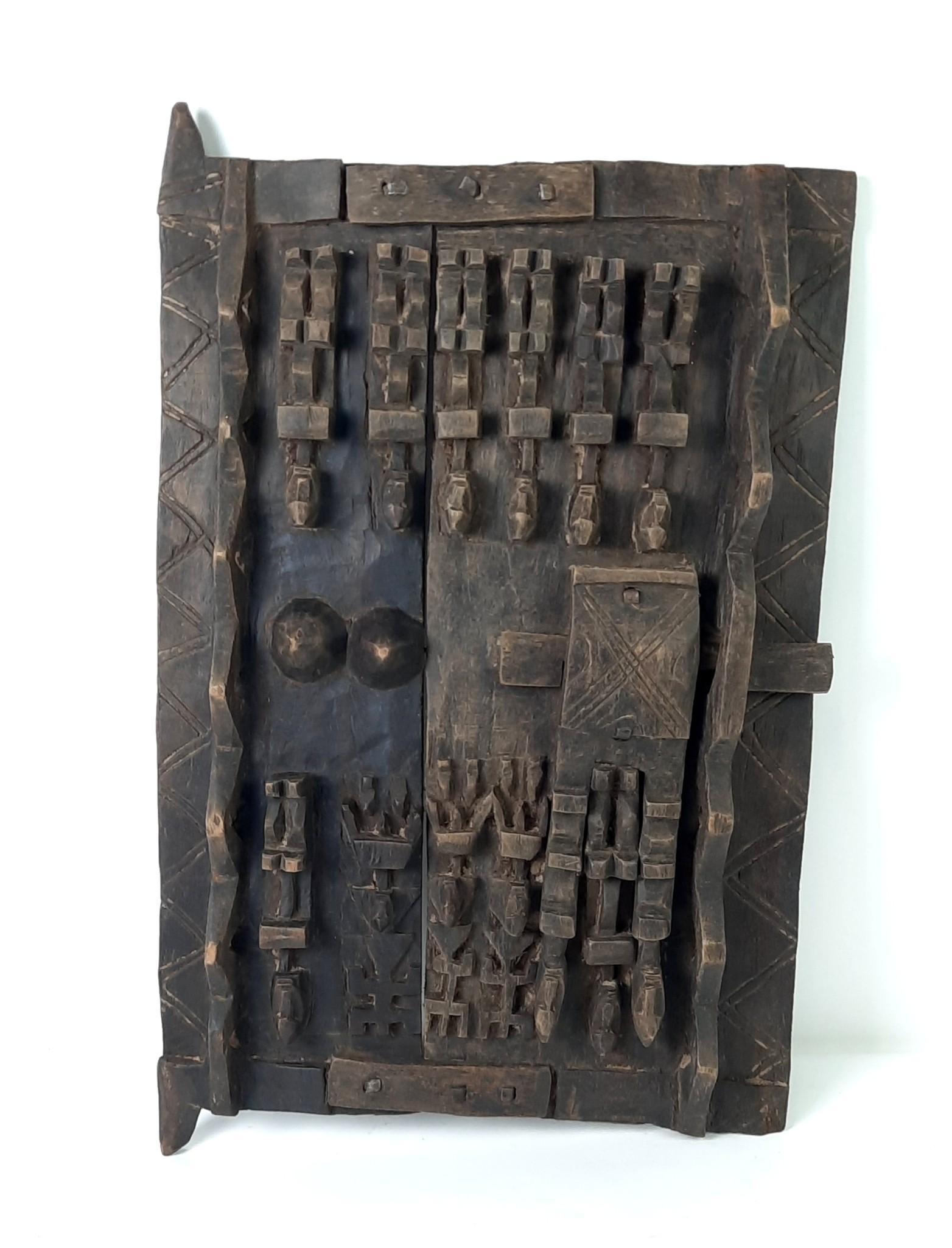 Dogon Mali Granary Door: Depicts "Kanaga" Headdress. 16" wide x 2-1/2" deep x 24-3/4" high. LR From the estate of Robert Harman. IMPORTANT: Before bidding, please read the terms and conditions. When you registered for the auc