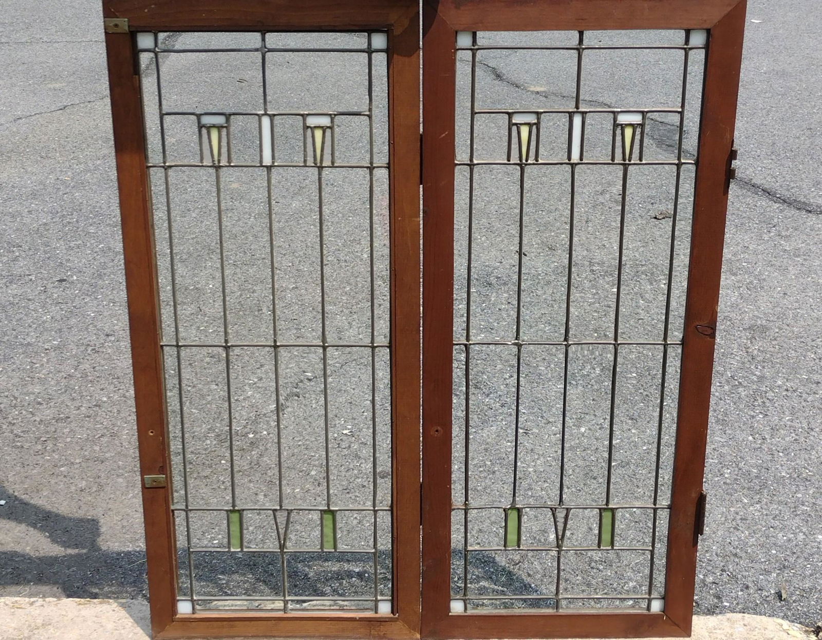 Pair Of Arts and Crafts Stained Glass Windows: Overall with frame each 15-1/4" wide X 36" high. MG. IMPORTANT: Before bidding, please read the terms and conditions. When you registered for the auction you agreed to these terms and will be required