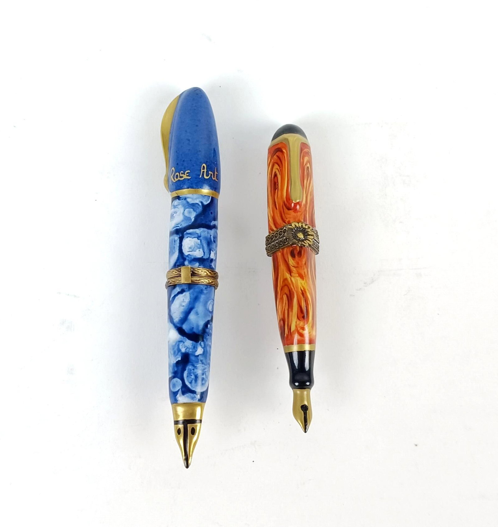 2 Limoges Fountain Pen Trinket Boxes: Made of porcelain. 3-1/2" to 4-1/4" long. MEG From the estate of Robert Harman. IMPORTANT: Before bidding, please read the terms and conditions. When you registered for the auction you agreed to these