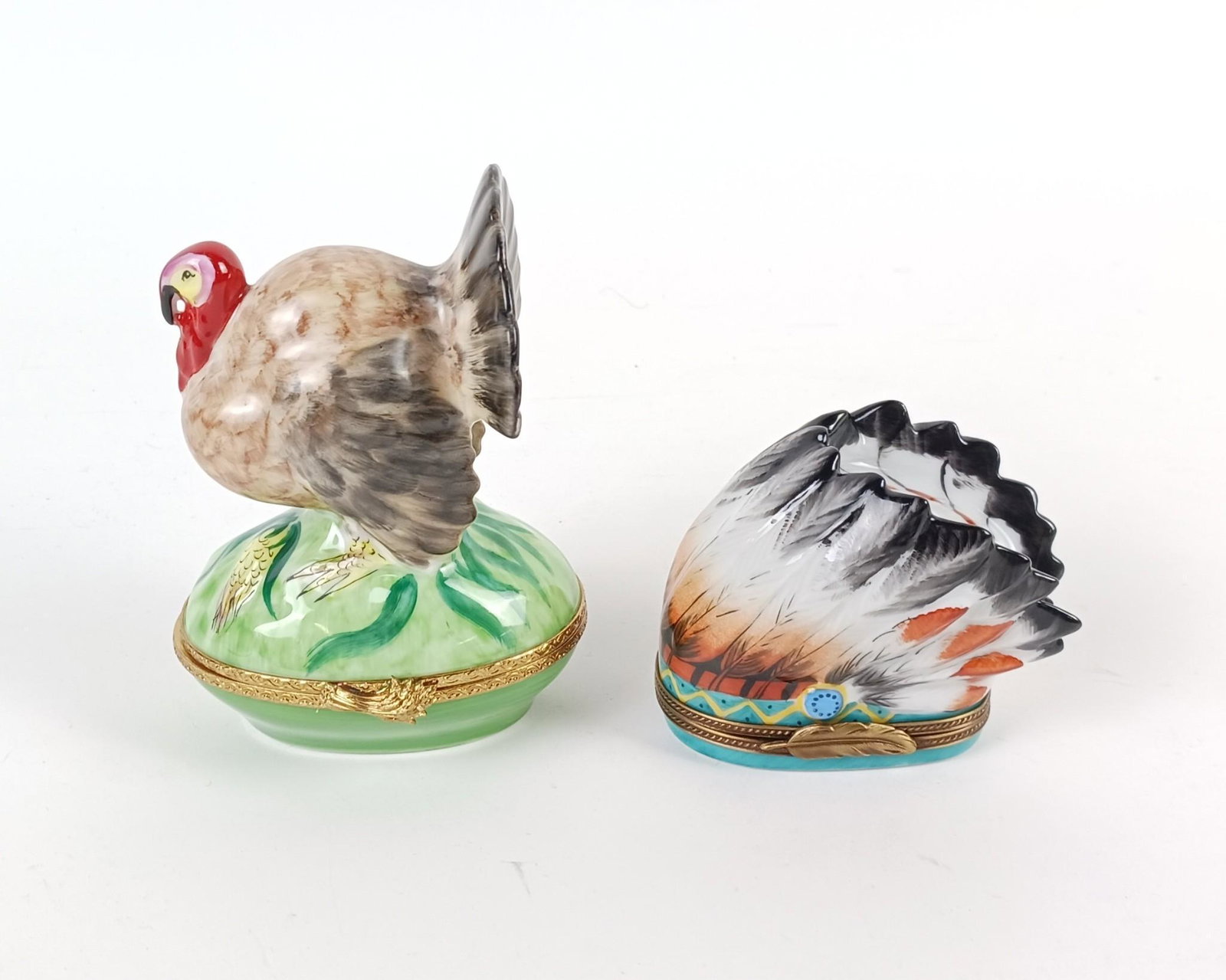 2 Limoges Tricket Boxes incl Turkey and Nat. Amer. Headdress: Made of porcelain. 2-1/4" to 4-3/4" high. MEG From the estate of Robert Harman. IMPORTANT: Before bidding, please read the terms and conditions. When you registered for the auction you agreed to these
