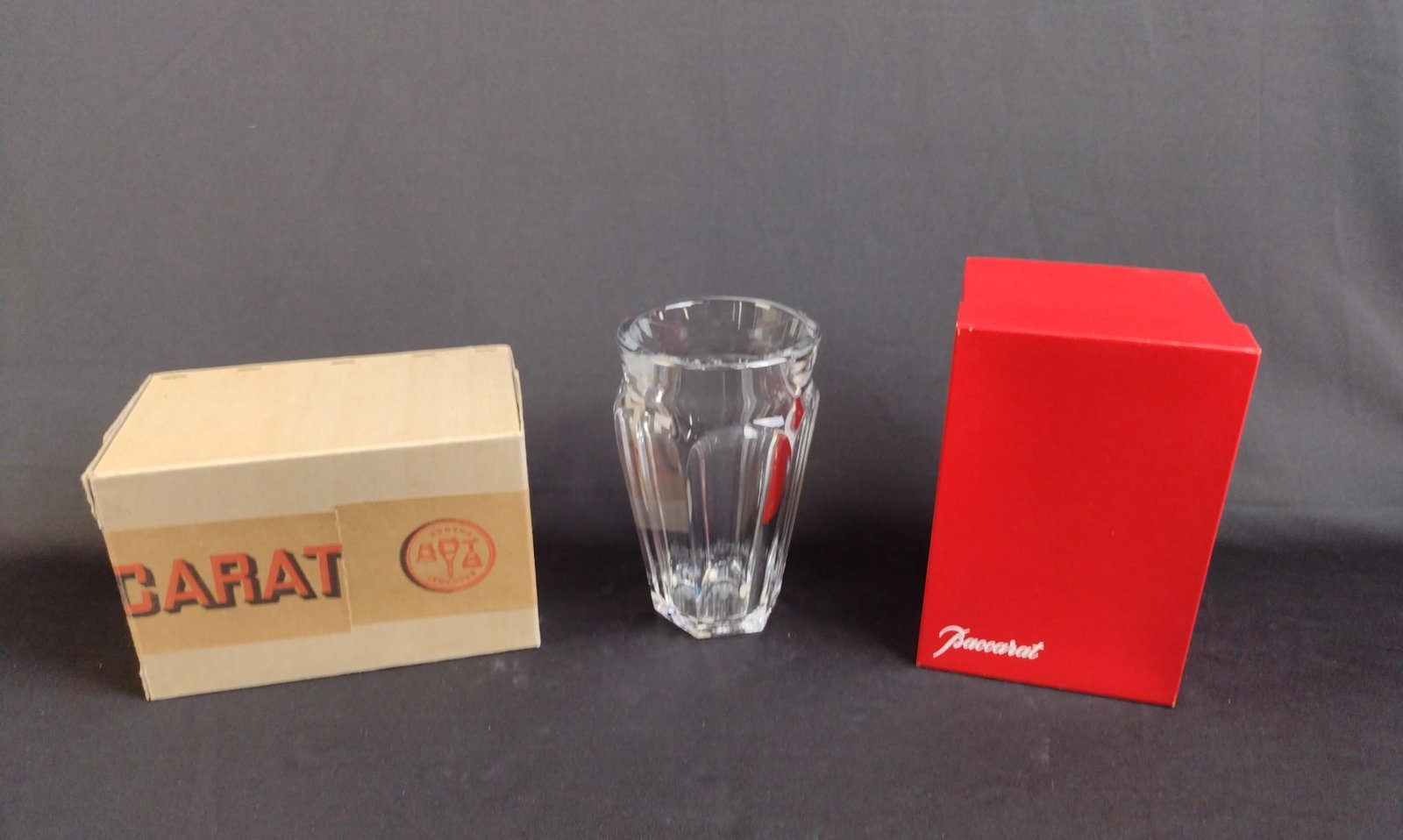 Baccarat Tally Rand Vase: 4" diameter x 6-3/4" high. With original and shipping box. MEG From the estate of Robert Harman. IMPORTANT: Before bidding, please read the terms and conditions. When you registered for the auction yo