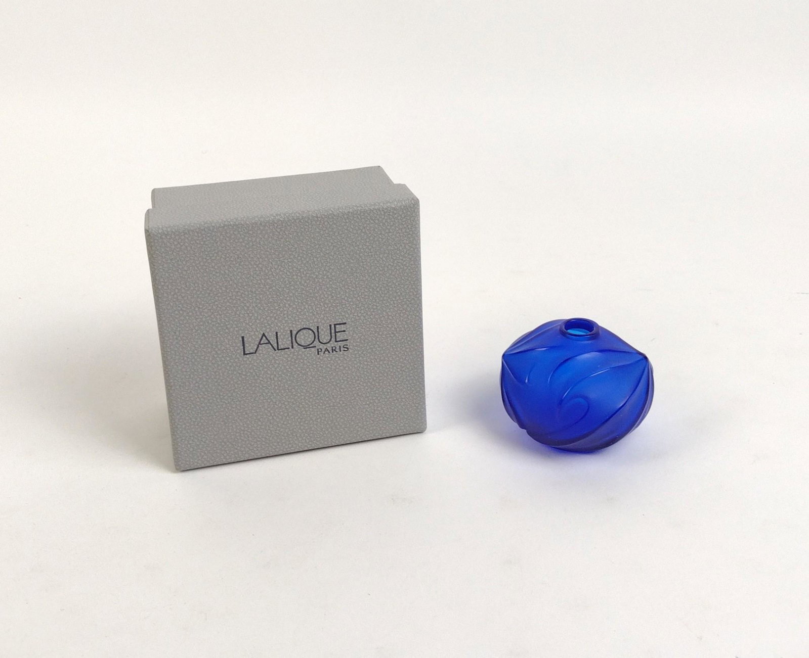 Lalique Palm Vase in Blue: Original box included. 2-3/4" diameter x 2" high. MEG From the estate of Robert Harman. IMPORTANT: Before bidding, please read the terms and conditions. When you registered for the auction you agreed 