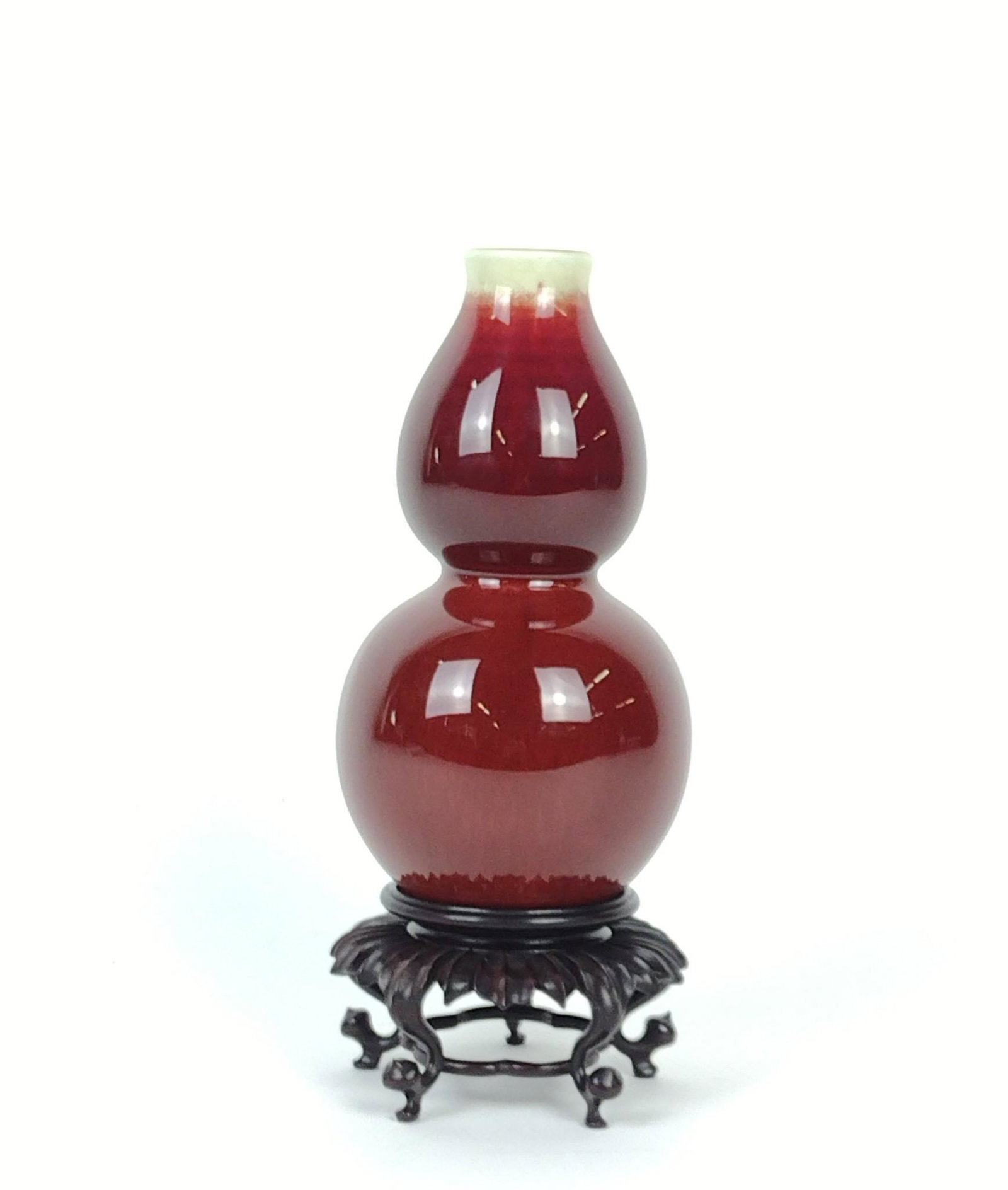 Chinese Sang de Boeuf Vase: 3-1/2" diameter X 6-1/2" high. Stand 2-1/4" high. MG. From the estate of Robert Harman. IMPORTANT: Before bidding, please read the terms and conditions. When you registered for the auction you agreed 