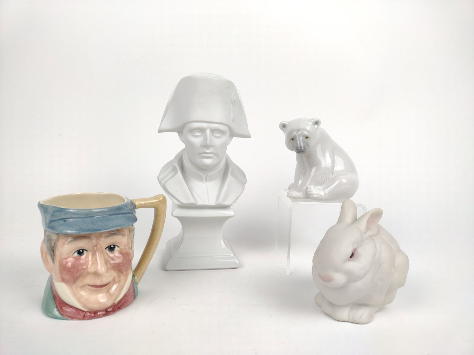 3 Figurines & Character Mug: Includes Limoges, Lladro, Cybis, and Staffordshire. 3-1/2" to 8-1/4" high. MG. From the estate of Robert Harman. IMPORTANT: Before bidding, please read the terms and conditions. When you registered fo