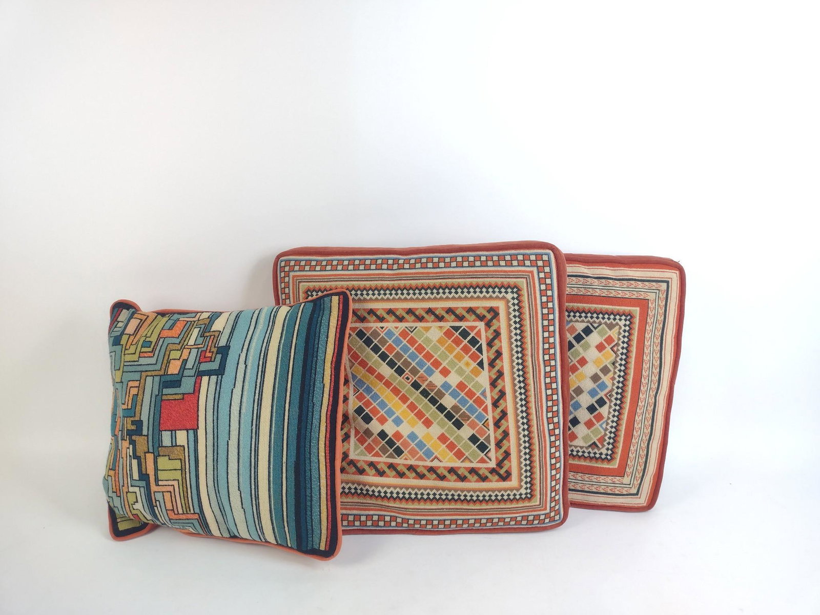 3 Geometric Pillows: 14" to 16" wide X 13" to 16" high. MEG From the estate of Robert Harman. IMPORTANT: Before bidding, please read the terms and conditions. When you registered for the auction you agreed to these terms 