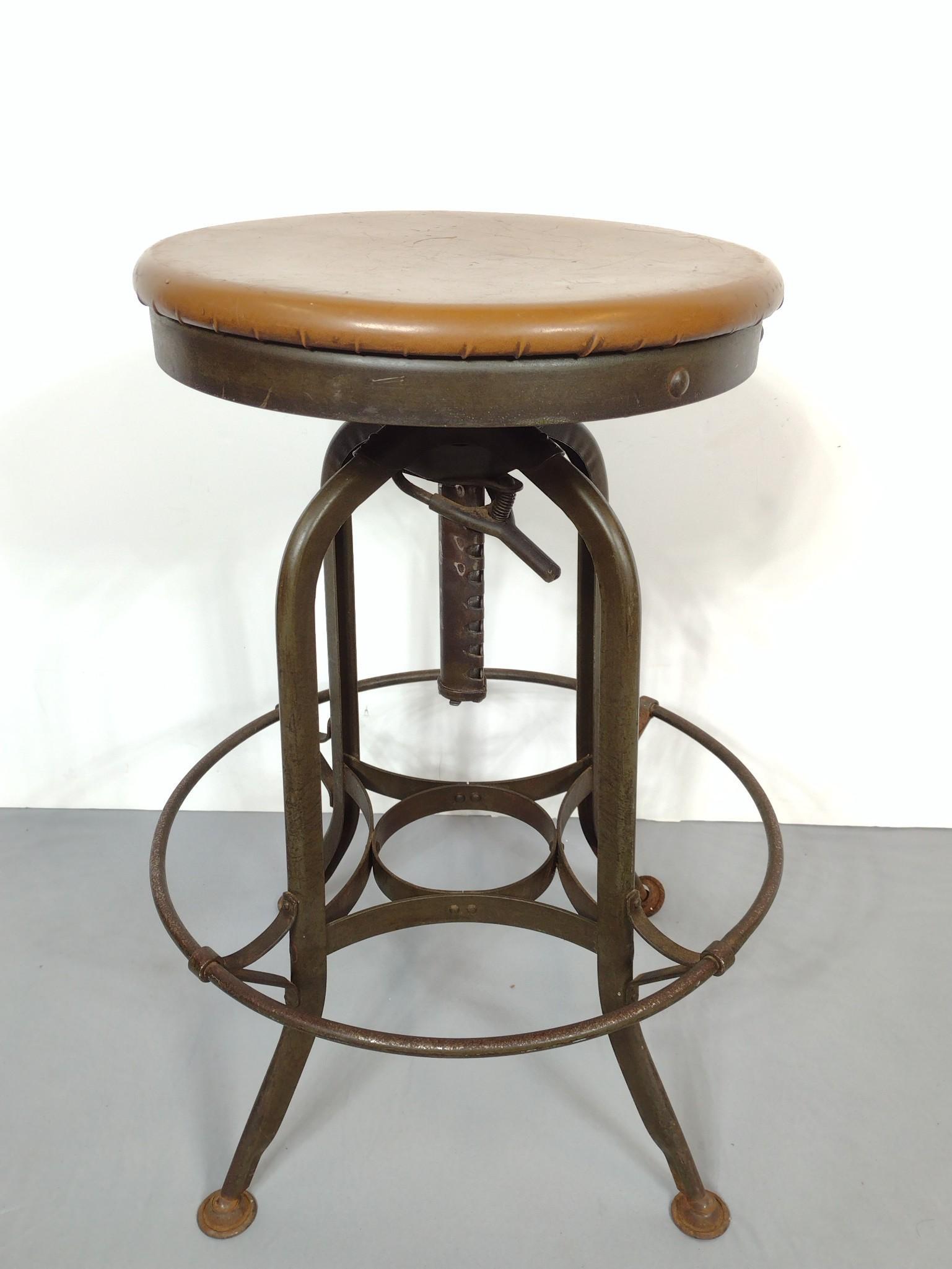 UHL Steel Furniture Stool: 18-3/4" diameter X 25-1/2" high. Has finish loss and rust on base. MG. IMPORTANT: Before bidding, please read the terms and conditions. When you registered for the auction you agreed to these terms an