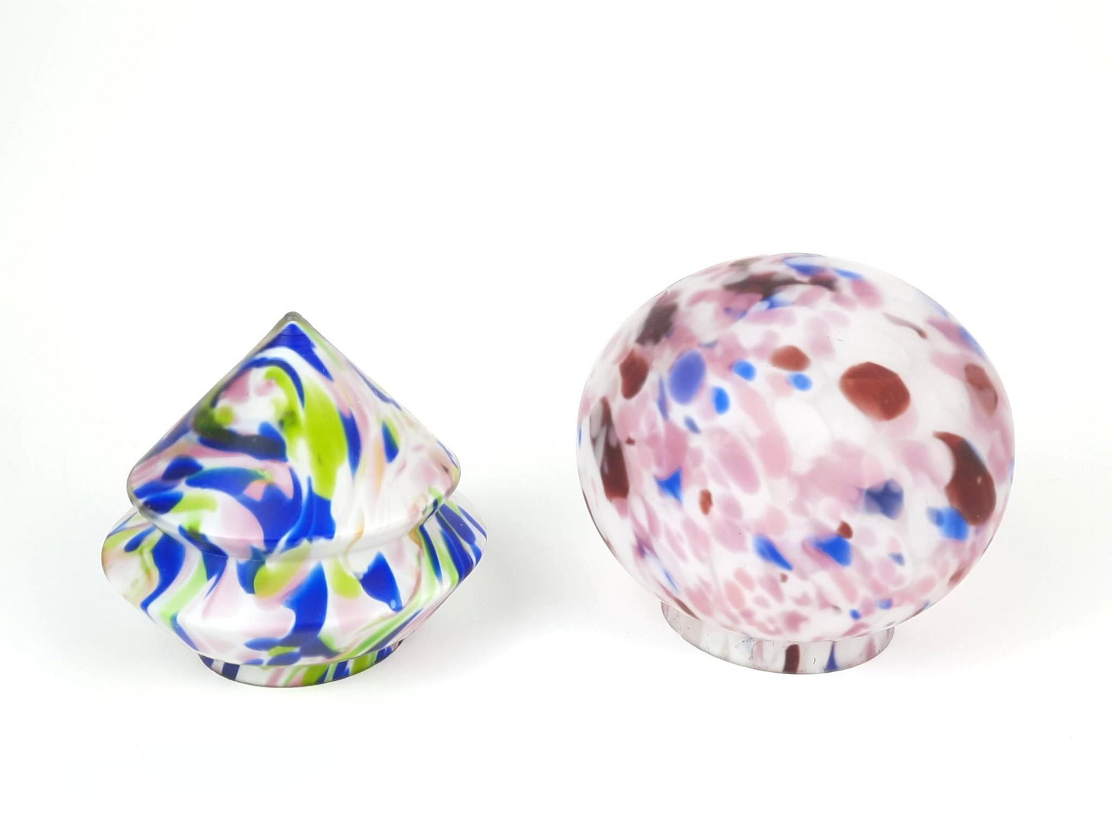 2 Art Glass Lamp Shades: Unmarked. Blue, green and pink: 4-3/4" diameter x 4-1/4" high. Opening 2-3/4" diameter. Pink, purple and white: 5-1/2" diameter x 4-3/4" high. Opening 3" diameter. Both openings with chips. LR IMPORTA
