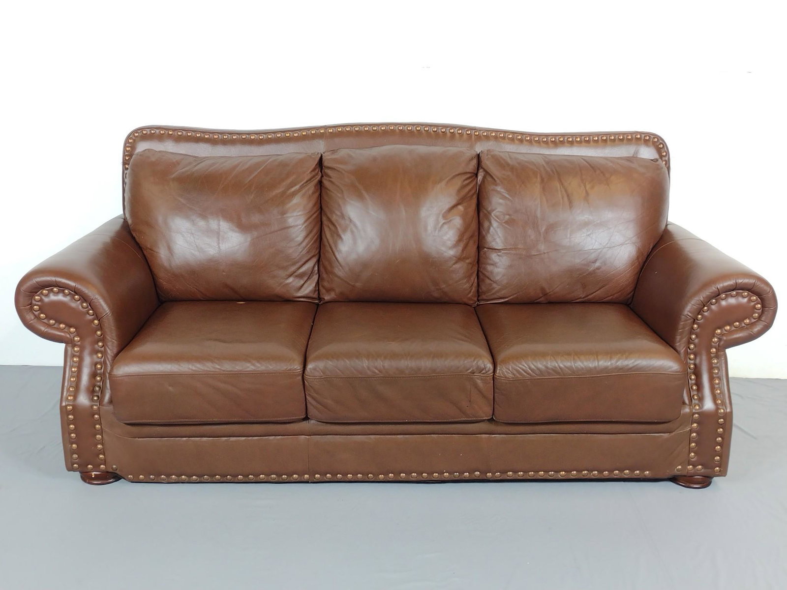 Leather Sofa: 89" wide X 27" deep X 40" high. Has some areas of finish loss. No manufactures name found. MG. IMPORTANT: Before bidding, please read the terms and conditions. When you registered for the auction you 