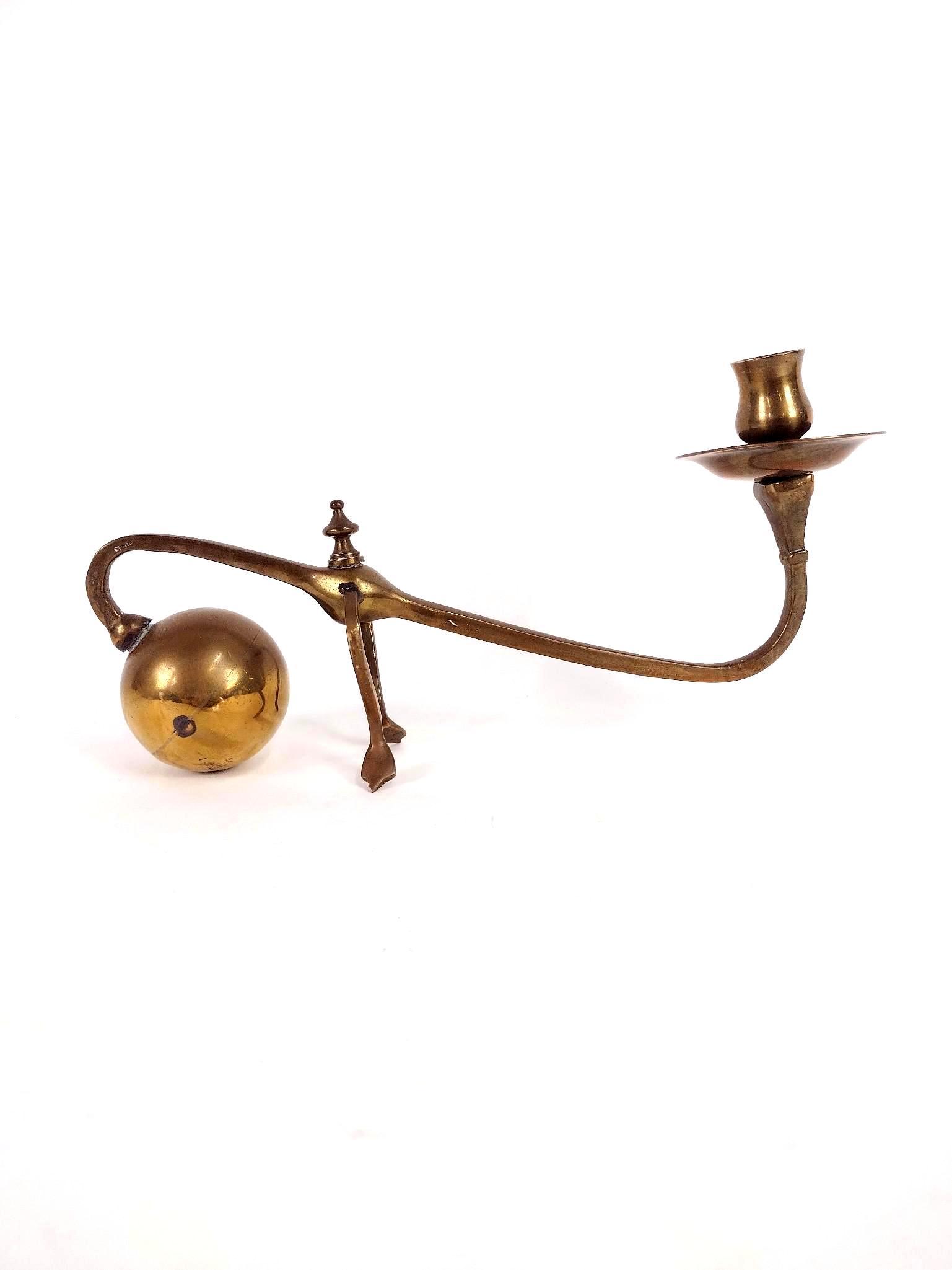 Brass Counterbalance Cannonball Candle Holders: Marked "Spain". 6-1/2" high X 12-1/2" wide. EL IMPORTANT: Before bidding, please read the terms and conditions. When you registered for the auction you agreed to these terms and will be required to co