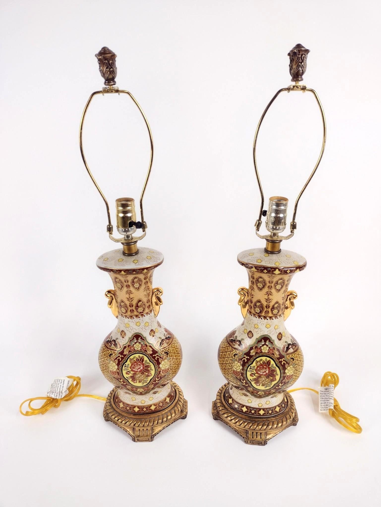 Pair of Floral Lamps: Made of porcelain. Working. 7-1/2" wide X 6" deep X 29-1/2" high. EL IMPORTANT: Before bidding, please read the terms and conditions. When you registered for the auction you agreed to these terms and 