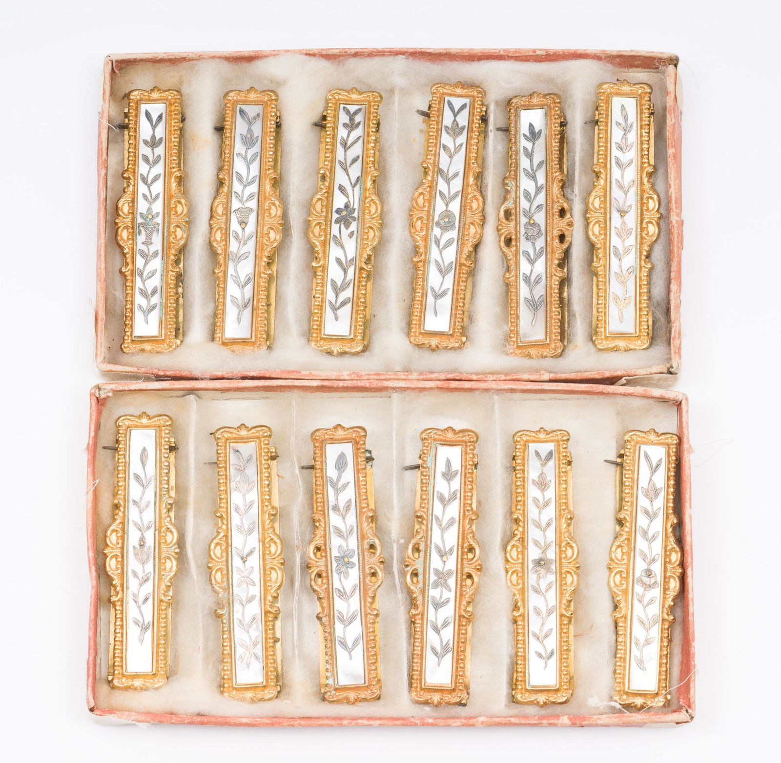 12 Victorian Gilt And Mother Of Pearl Sash Buckles: Set of twelve Victorian gilt and mother of pearl sash buckles. Identical designs. Each 3" wide x 5/8" high. No defects noted. AJ. IMPORTANT: Before bidding, please read the terms and conditions. When