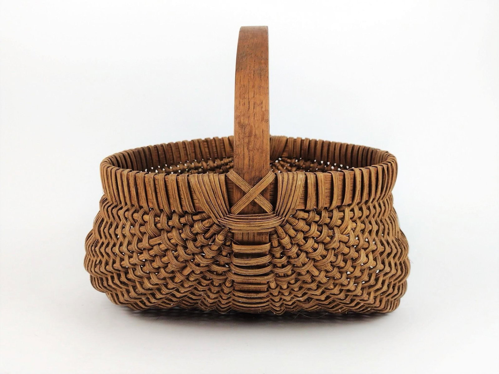 Buttocks Basket: 14" wide x 13-1/2" deep x 13" high. From the estate of Robert Harman. IMPORTANT: Before bidding, please read the terms and conditions. When you registered for the auction you agreed to these terms and