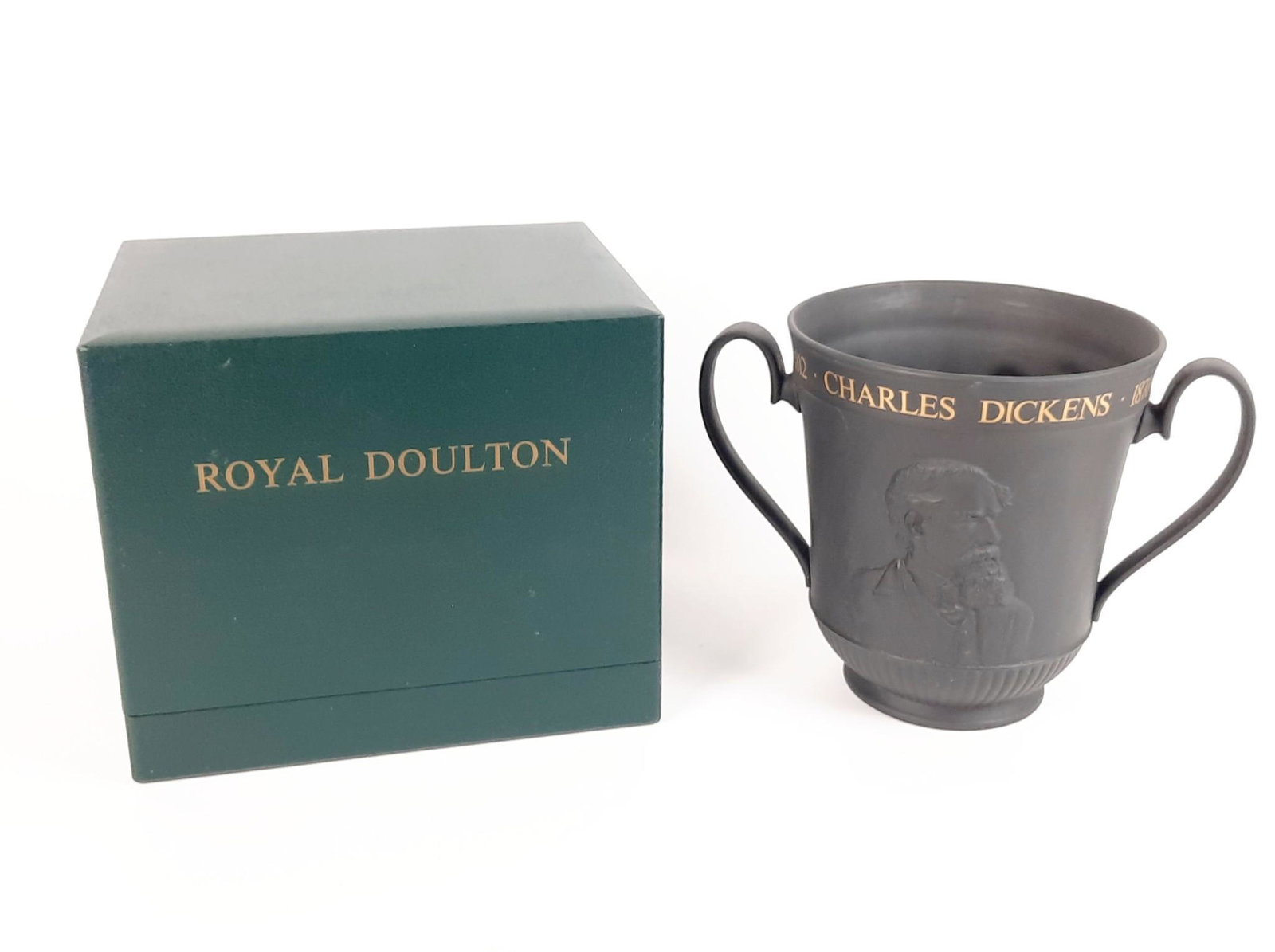 Royal Doulton Charles Dickens Loving Cup: Original box included. Centenary of the death of Charles Dickens. Model number 166. Certificate of authenticity included. Loving cup: 11-1/4" wide x 7-1/2" deep x 8" high. LR IMPORTANT: Before bidding