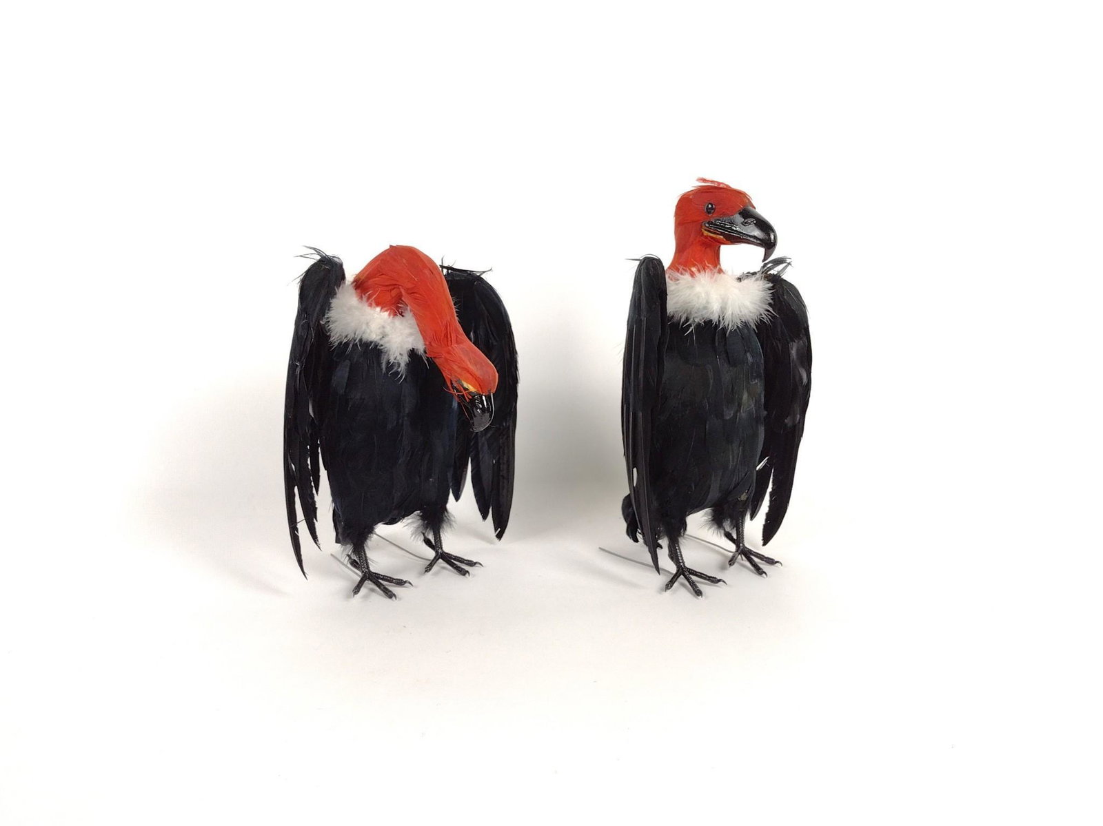 Sylvio and Tony Vulture Figurines: Feathers on foam body. 10" to 11-1/2" high x 6-1/2" to 7-3/4" wide. Both with original box. BC IMPORTANT: Before bidding, please read the terms and conditions. When you registered for the auction you