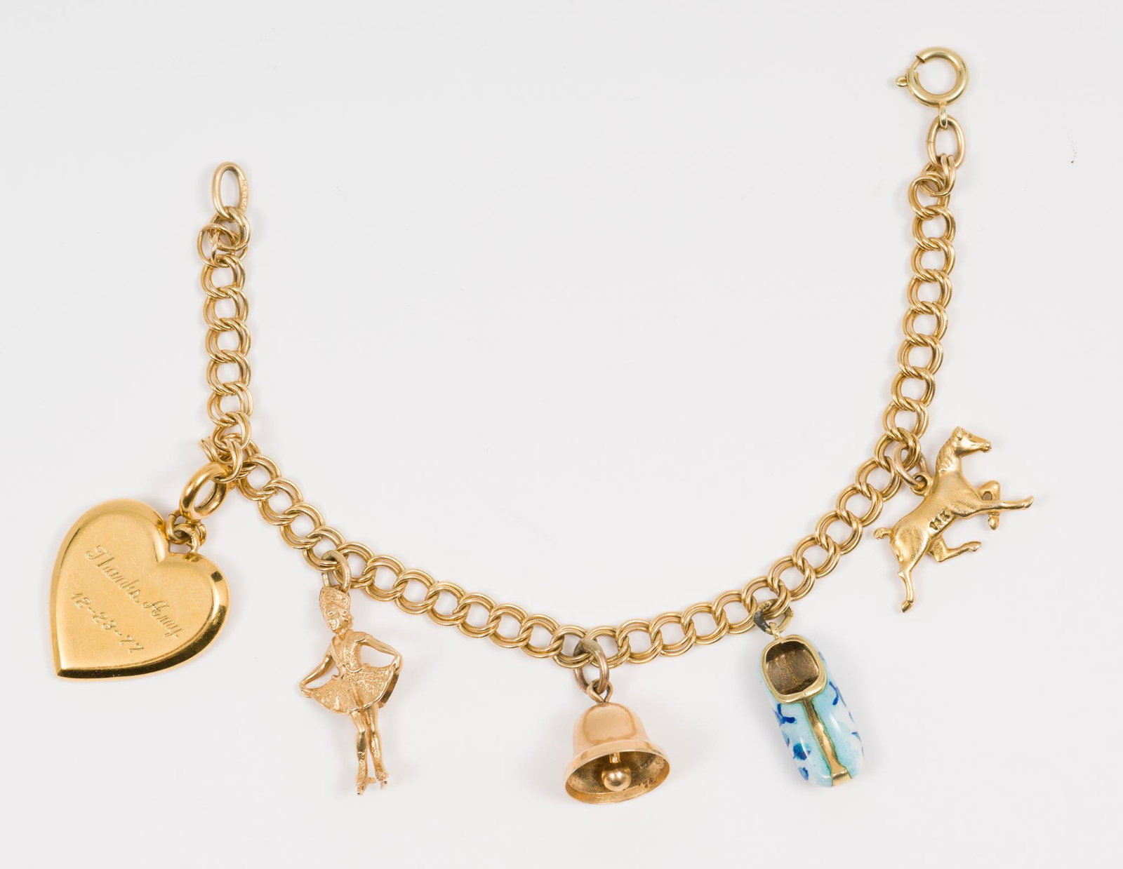 14K Gold Charm Bracelet: Marked 585 bracelet with five charms marked 14K or 585. Bracelet 6" long. Charms 1/2" to 1" long. 11.8 dwt. MH. IMPORTANT: Before bidding, please read the terms and conditions. When you registered for