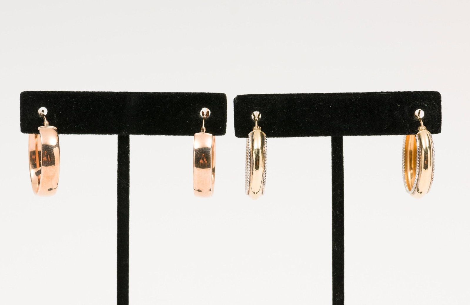 2 Pair of Earrings, 14K Gold and Bronze: One pair marked 585. One marked Milor Bronze. 1" long. Gold earrings 1.8 dwt. MH. IMPORTANT: Before bidding, please read the terms and conditions. When you registered for the auction you agreed to the