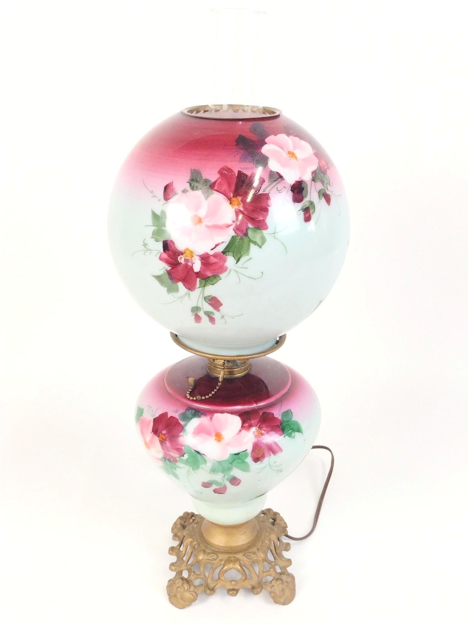 Floral Gone With The Wind Lamp: Working. 8" diameter X 23" high. EL IMPORTANT: Before bidding, please read the terms and conditions. When you registered for the auction you agreed to these terms and will be required to comply with t