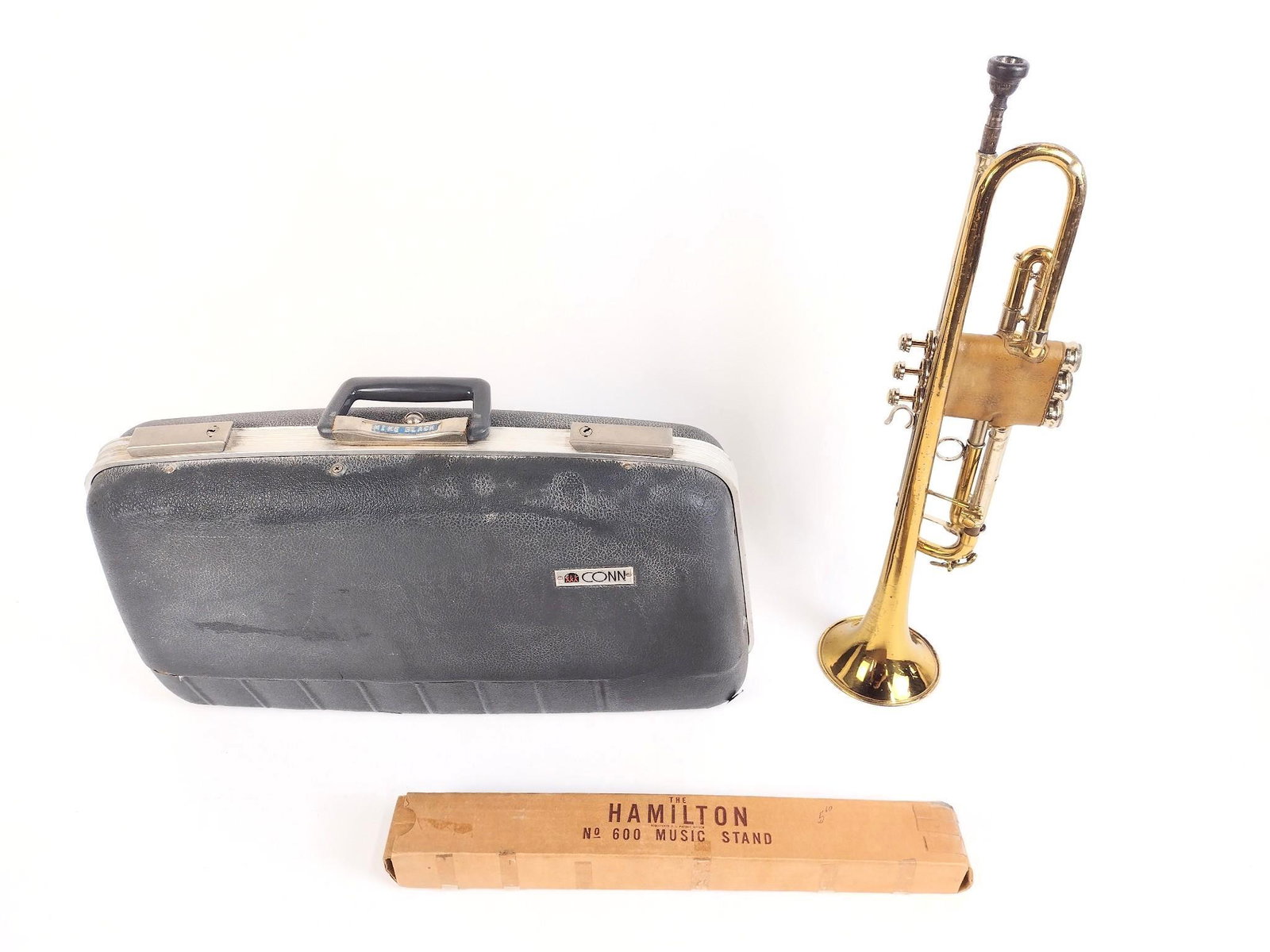 Breuscher Trumpet: With case and The Hamilton Music Stand. EL IMPORTANT: Before bidding, please read the terms and conditions. When you registered for the auction you agreed to these terms and will be required to comply