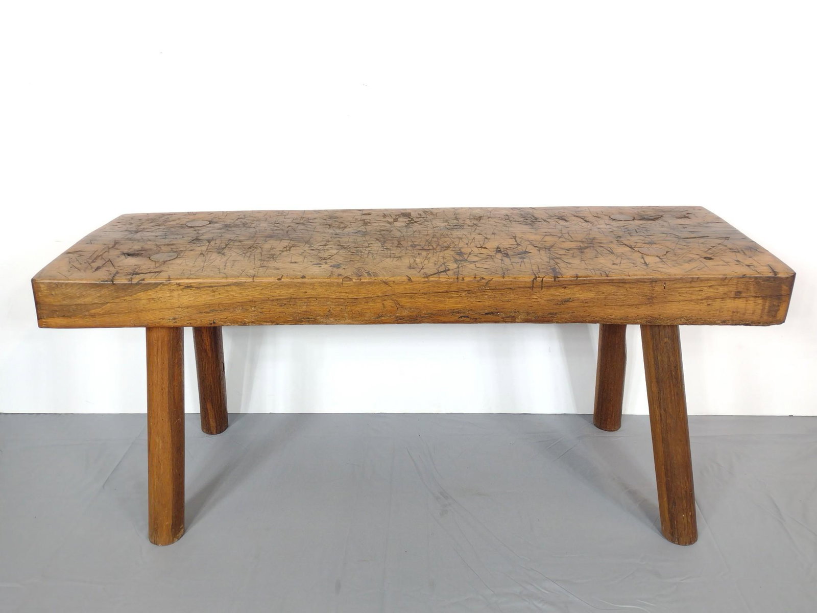 Butchering Table: 55" wide X 18" deep X 23-1/2' high. Top 4" thick. Has expected wear. MG. IMPORTANT: Before bidding, please read the terms and conditions. When you registered for the auction you agreed to these terms 