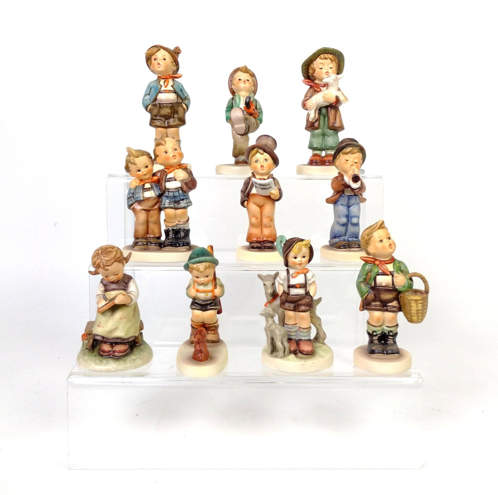 10 Hummel Figurines: Includes Hum numbers: 131, 79, 31, 6, 123, 85, 357, 68, 200, and 95. 4-3/4" to 5" high. BC IMPORTANT: Before bidding, please read the terms and conditions. When you registered for the auction you agre