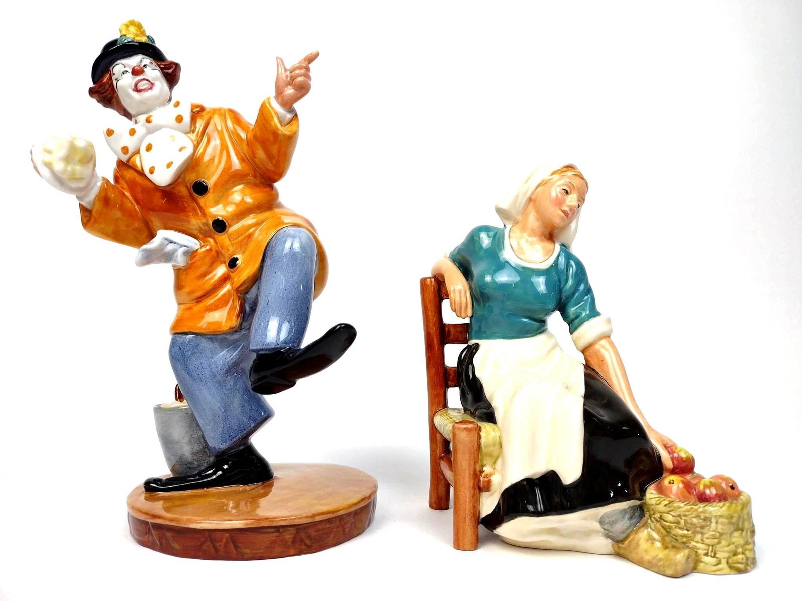 2 Royal Doulton Figurines Incl. The Clown & The Apple Maid: Includes 1.) The Clown. HN 2890. 2.) The Apple Maid. HN 2160. 6-1/2" and 9" high. AJ.