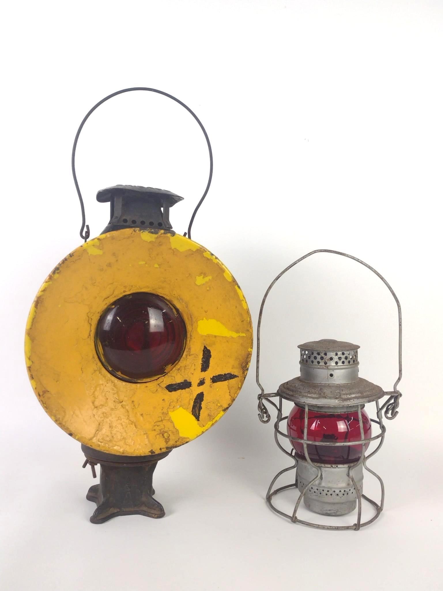 Adlake Blue/Red Signal Lamp + Adams & Westlake RR Lanturn: 7-1/2" to 10" wide X 6" to 10" deep X 13-3/4" to 16-3/4" high. Both with some finish loss and rusting. MG.