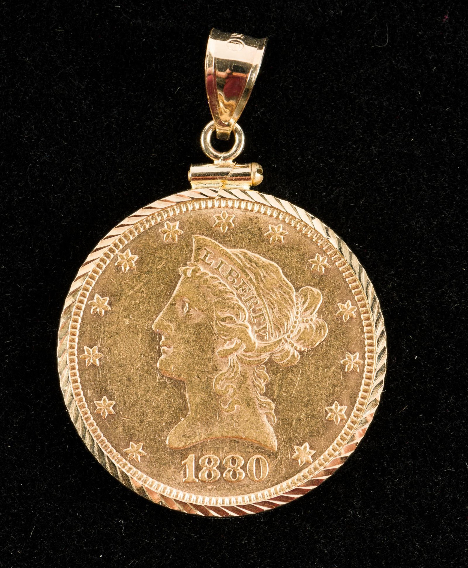 1880 $10.00 Gold Coin: 1880 $10.00 gold coin. As pendant. Coin weighs 10.8 dwt/16.7 g, with total weight of 11.7 dwt/18.2 g including 14k bezel. VG. AJ.
