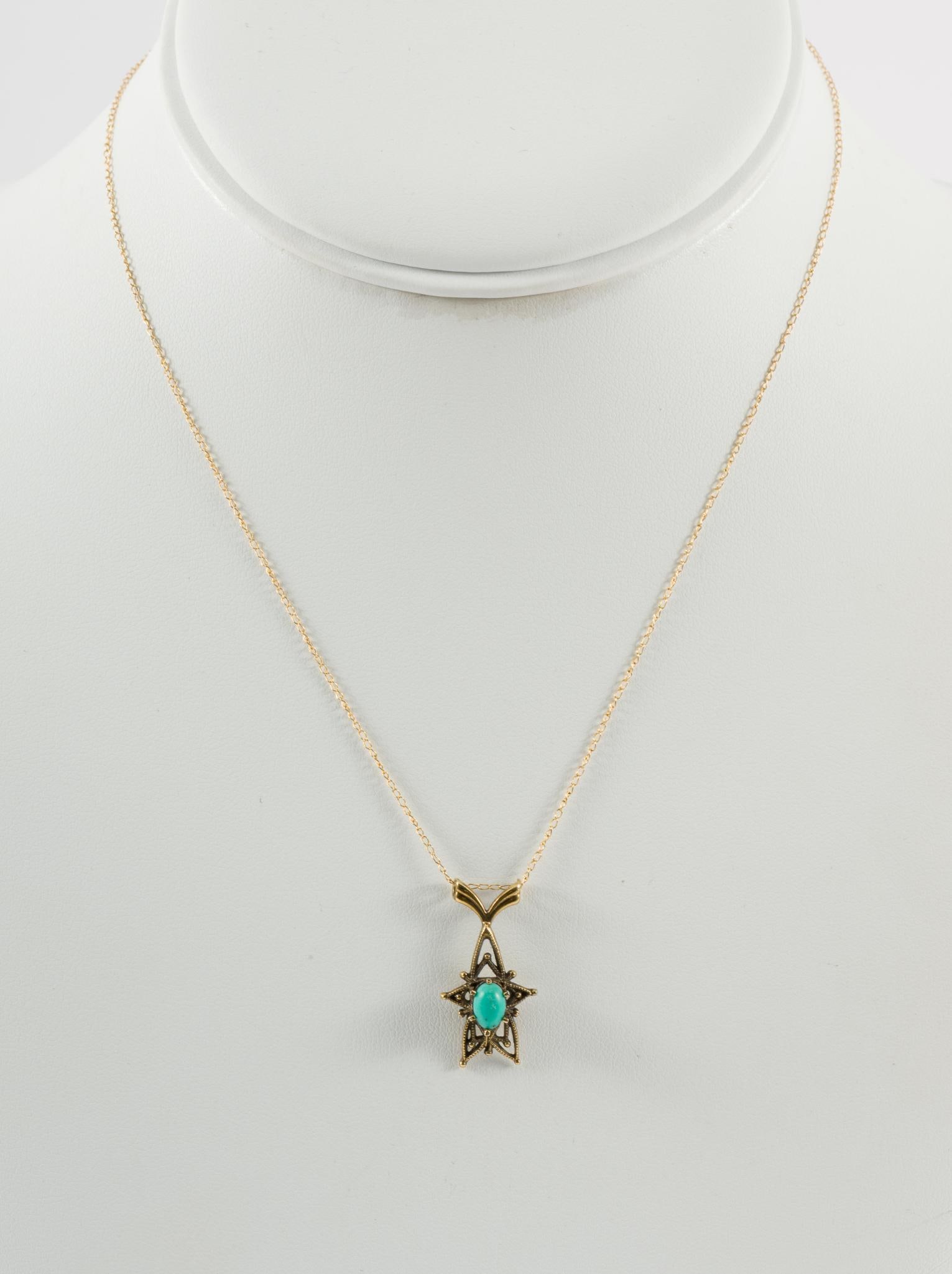 14k Gold & Turquoise Pendant Necklace: Chain 15" long. Pendant with oval turquoise cabochon 7/8" high. Chain marked 14k. 1.1 total dwt/1.7 g. AJ/EK