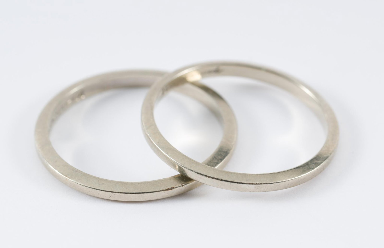 2 14k White Gold Bands: Size 7. Marked 14k to interior. 1.9 total dwt/3.0 g. AJ.