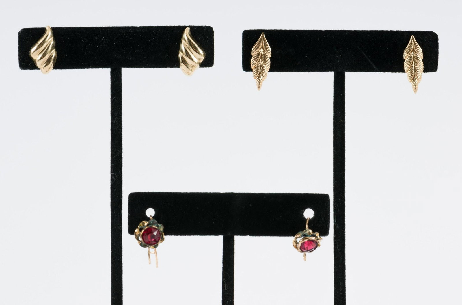 3 Pairs Of 14k Gold Earrings: Marked and tests 14k. 3/8" to 3/4" long. 1.8 total dwt/ 2.8 g. AJ.