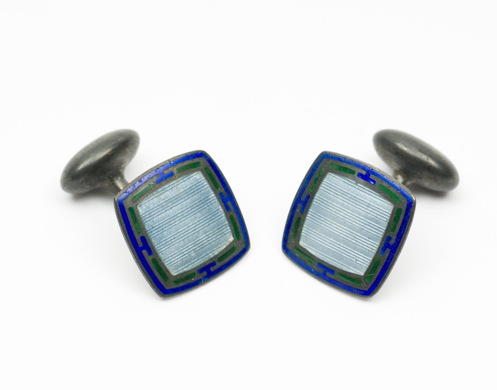 Pair Of Sterling Enamel Cufflinks: Marked sterling on back. 1/2" wide x 1/2" high. AJ.