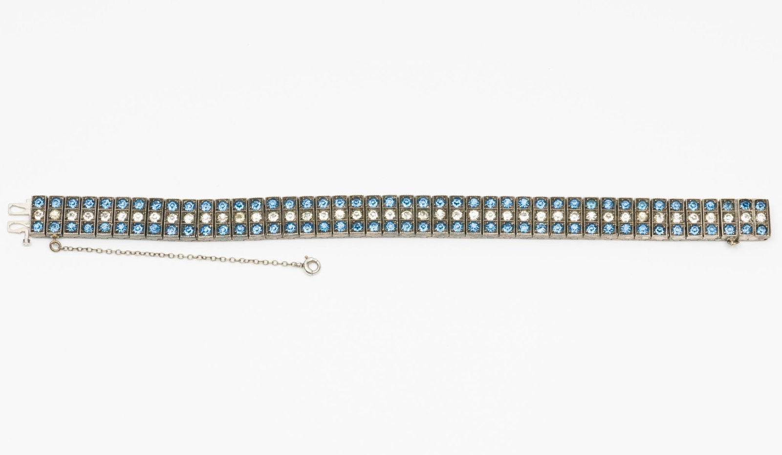 Sterling And Rinestone Bracelet: 6-7/8" long with adjustable chain. 3/8" wide. Marked sterling on back. AJ.