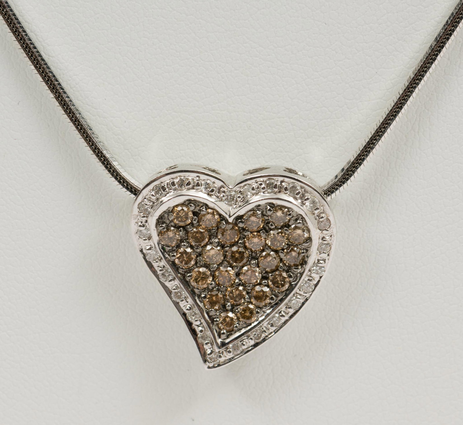 Italian 14K White Gold & Diamond Pendant Necklace: Chain marked marked 750 Italy. Pendant marked 585 Italy. 3/4" pendant on 18" chain. Approximately 1 CTW round cut white and champagne diamonds. 8.7 dwt total/13.5 g. MH/EK