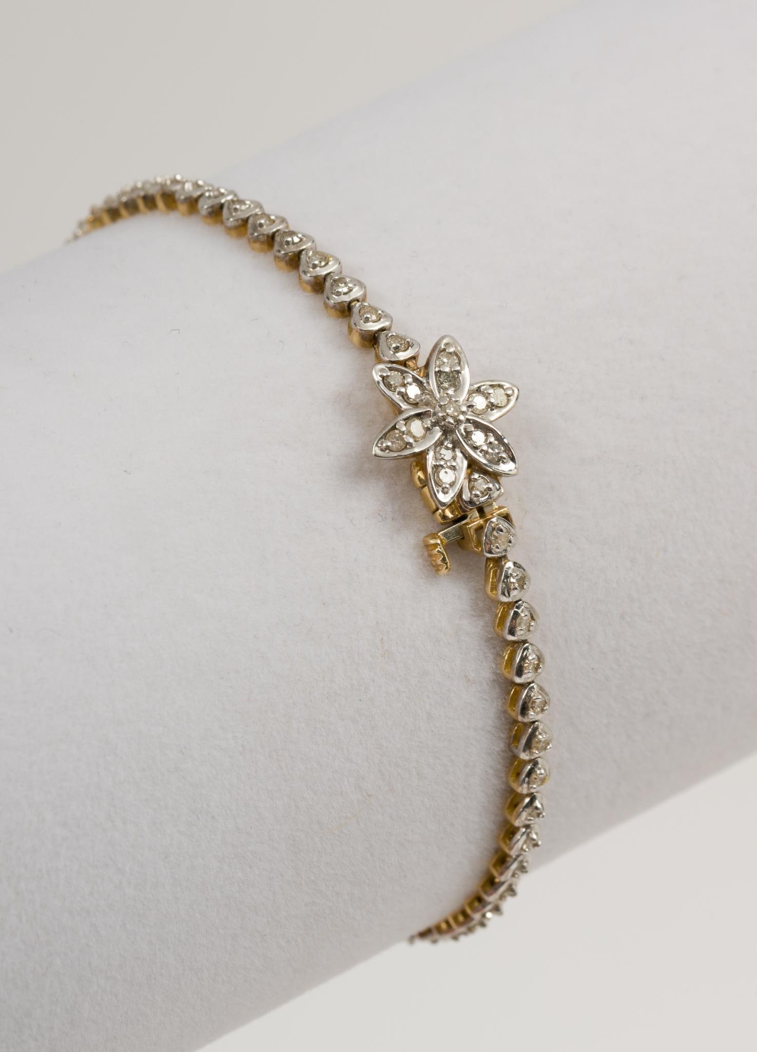 10K White and Yellow Gold Diamond Bracelet: Marked 10K. 7" long. 1/8" wide. 4.1 dwt/6.4 g. MH.