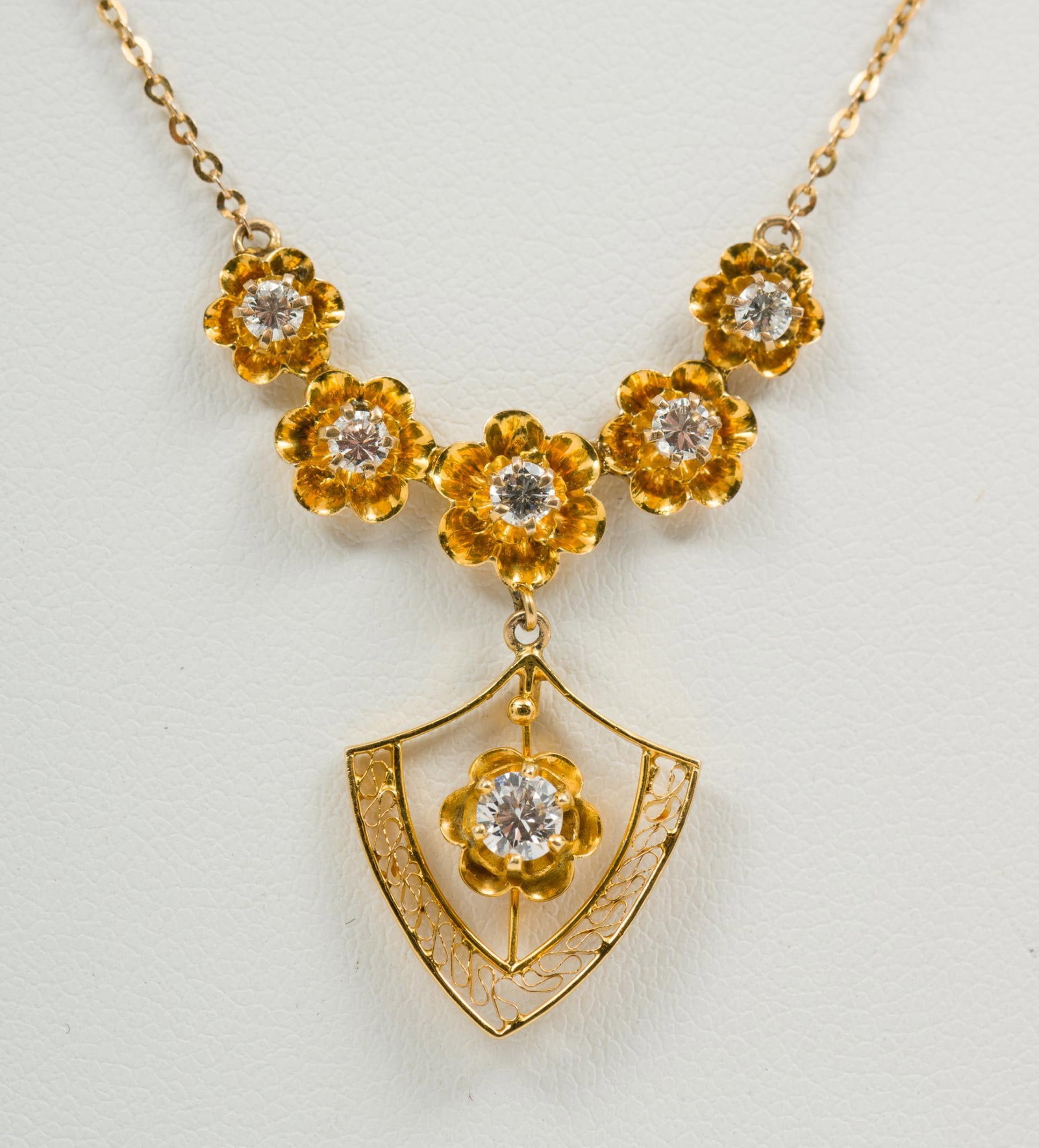 14K Gold and Diamond Pendant Necklace: Marked 14K. 15" long with 3/4" long pendant. One .15 carat and five .05 carat each round brilliant cut diamonds (Clarity VS1, Color G-H). 1.4 dwt/2.2 g. MH/EK