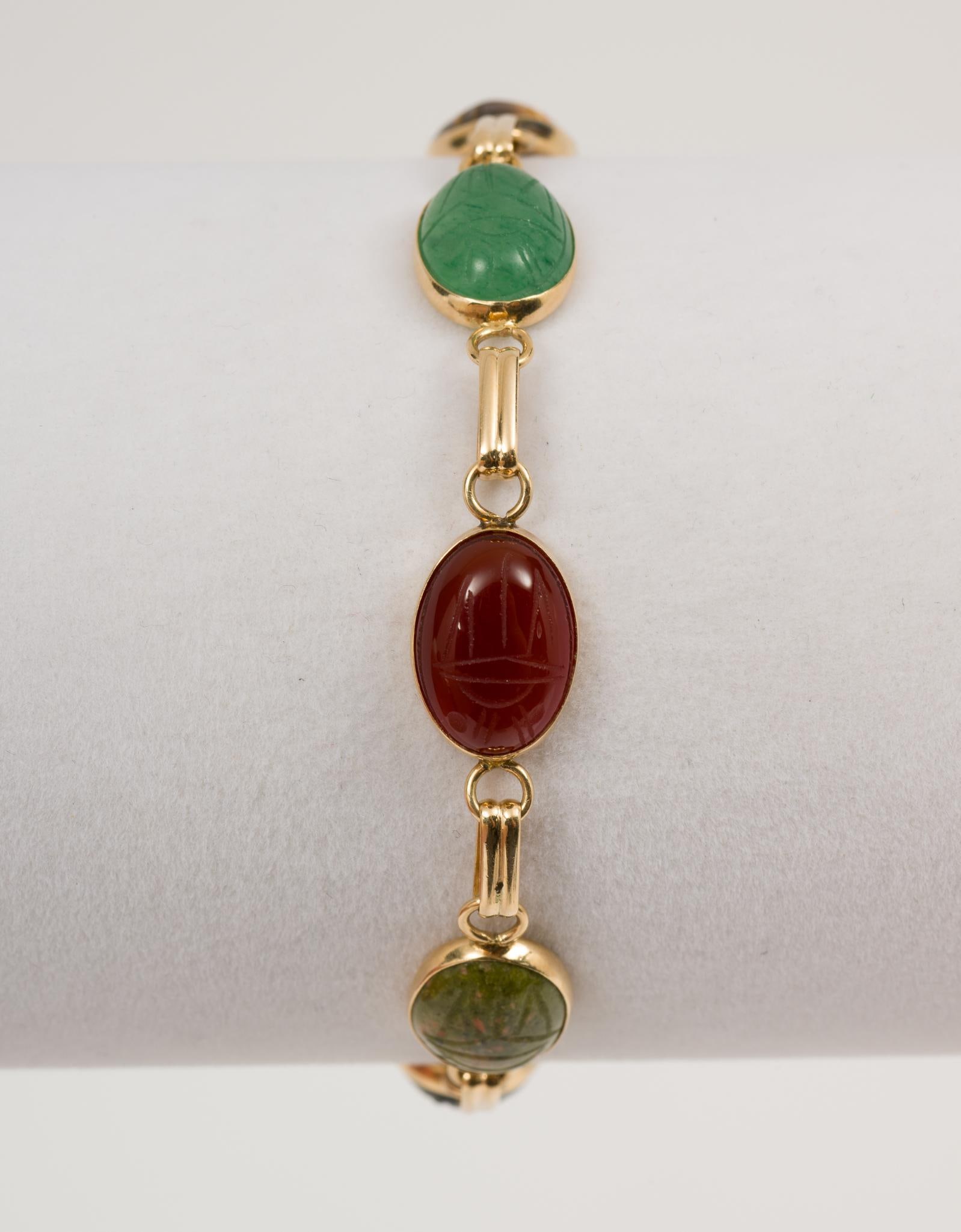 14K Scarab Bracelet: Marked 14K. Carved scarabs incl rhodonite, tiger's eye, carnelian, jasper, onyx, chrysoprase. 7-1/2" long. Replaced clasp. MH.