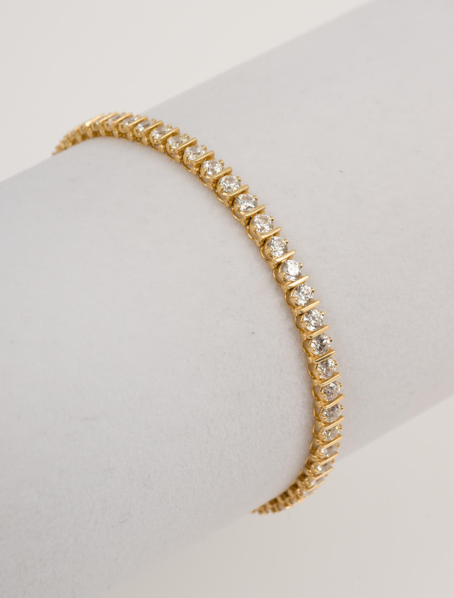 14K Gold CZ Tennis Bracelet: Marked 14K. 7-1/4" long, 1/8" wide. 6.4 dwt/10 g. MH.