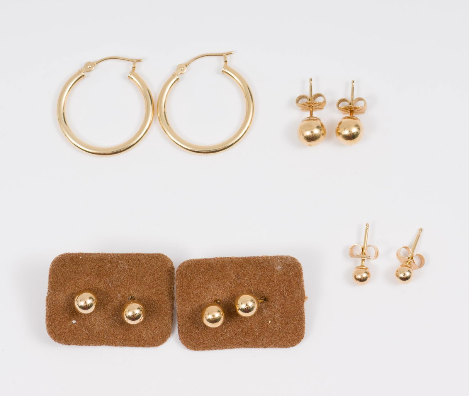 5 Pairs Of 14k Earrings: Marked 14k. 1/8" to 3/4 wide. 1.5 total dwt/2.3 g. AJ.