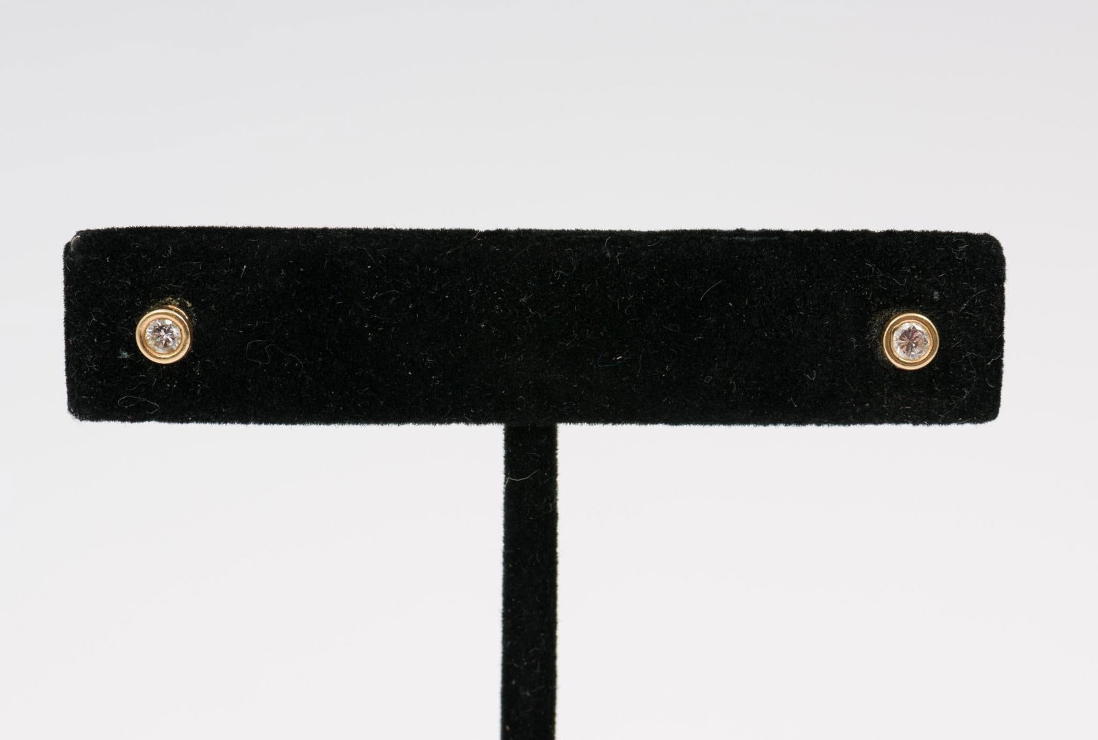 14k Gold & Diamond Earrings: 14k yellow gold stud earrings each with approximately .08 carat round cut diamond. 0.5 total dwt. AJ/EK