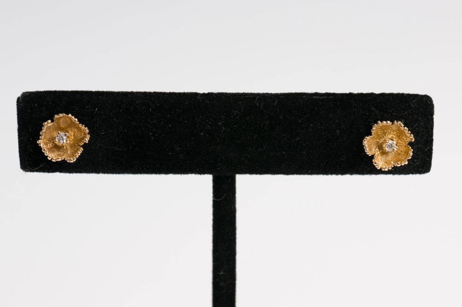 14k Gold & Diamond Earrings: Marked 14k screw back stud earrings. Each with .02 carat diamond. 1.1 dwt/1.7 g. 1/4" wide. AJ/EK