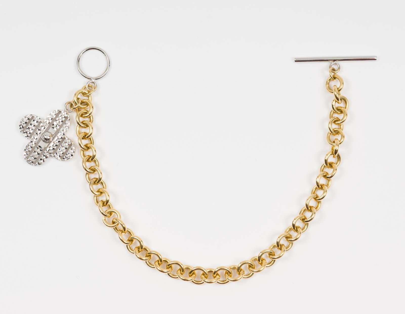 Bracelet With 18k White Gold Charm: Chain 7-1/4" long. Charm 7/8" wide x 7/8" high. Marked 18k and Turkey on back. 10 dwt / 15.6 grams. AJ.