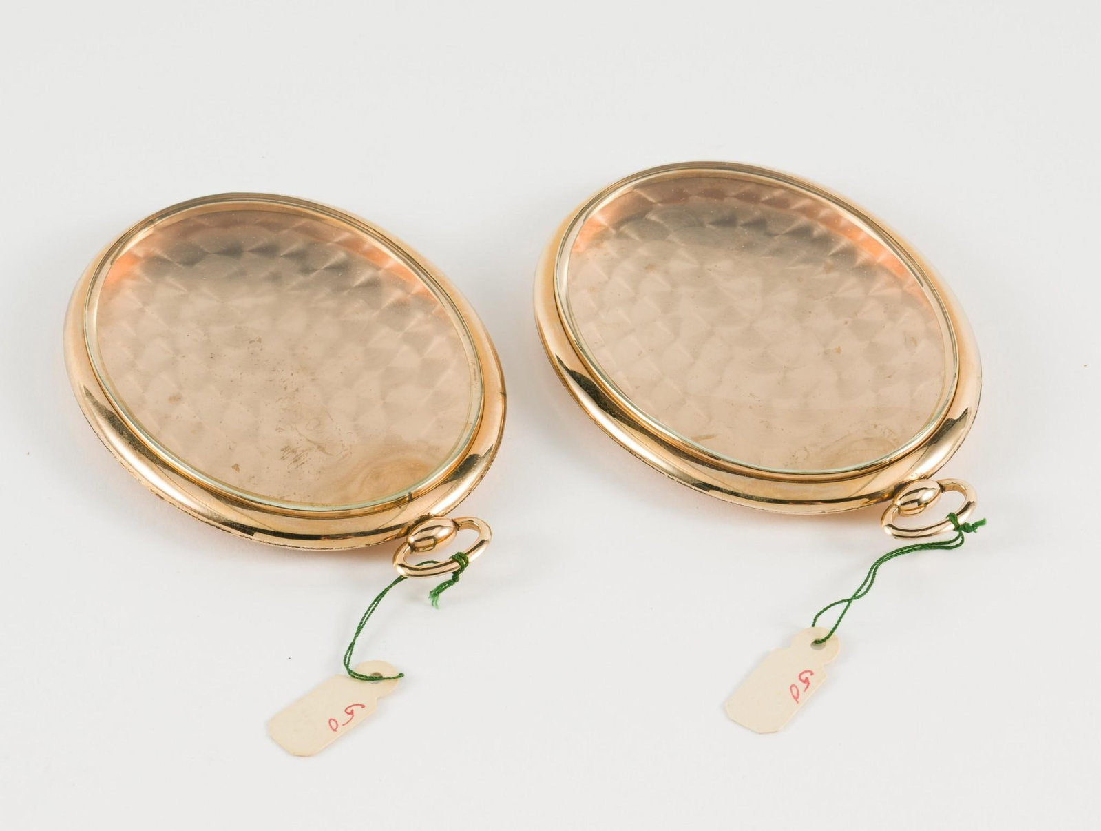 2 Wightman & Hough Co. Frames: DESCRIPTION: Two oval Wightman & Hough Co. frames. Frames marked "W&H Co." in a heart. Both with cloth cases. MEASUREMENT: Both 2-1/2" wide x 3-1/2" long. CONDITION: Some tarnishing. MEG